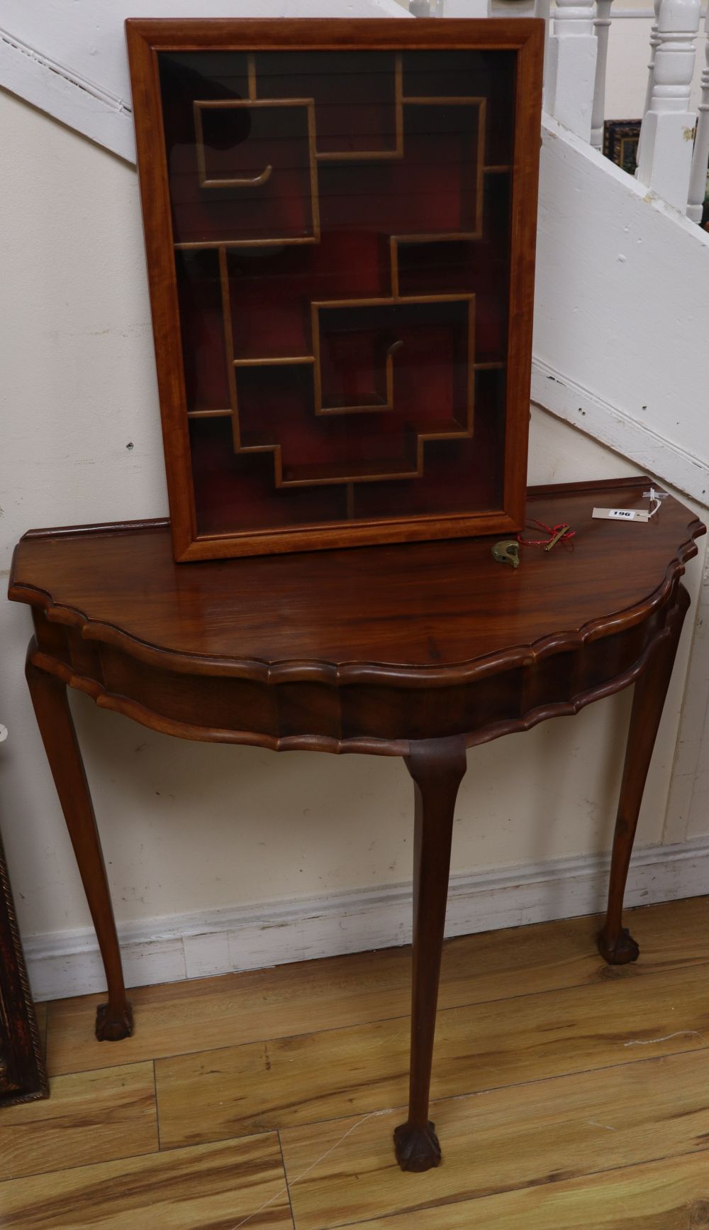 A Chinese hardwood demi-lune table together with a hanging cabinet, width 42cm, depth 9cm, height 56cm